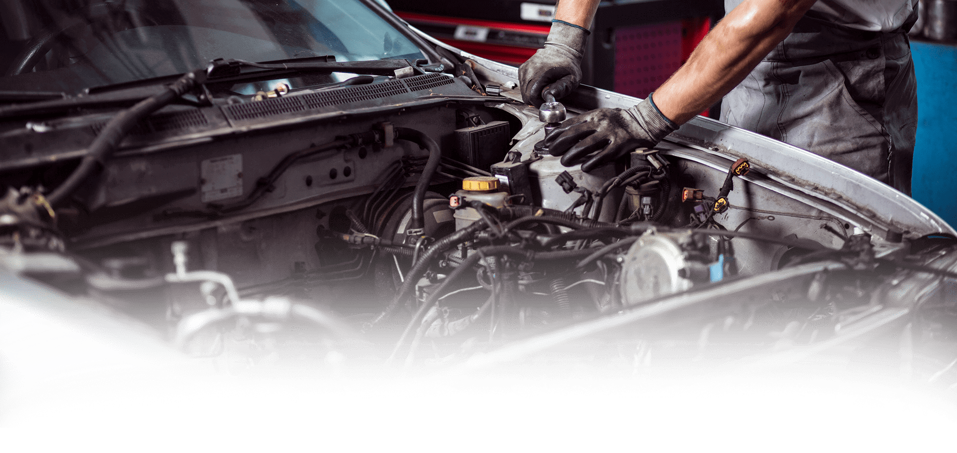 Experienced mechanic servicing a car at D & B Autocare